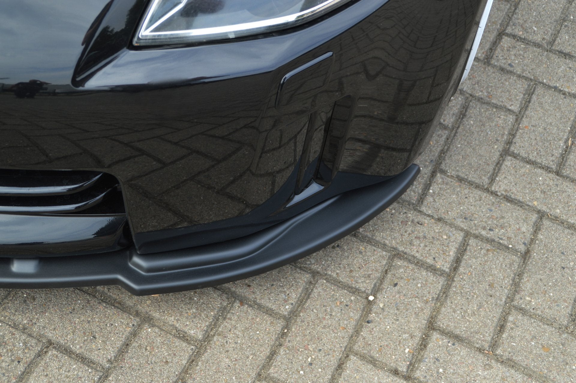 Frontspoilerlippe Cuplippe für Nissan 350Z ABS ab 2006, schwarzes Tuning-Teil, aus langlebigem Kunststoff.
