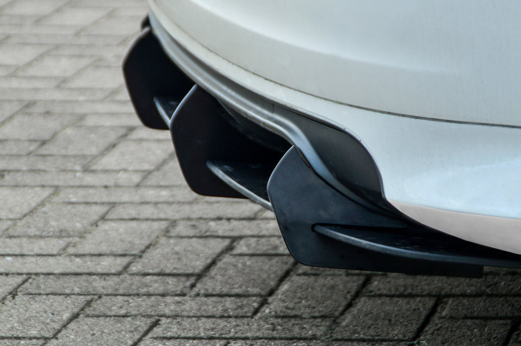 Gefräster Heckansatz für Audi S3 8P von Ingo Noak Tuning, zeigt detaillierte Oberfläche und Passform an der Fahrzeugheckpartie.