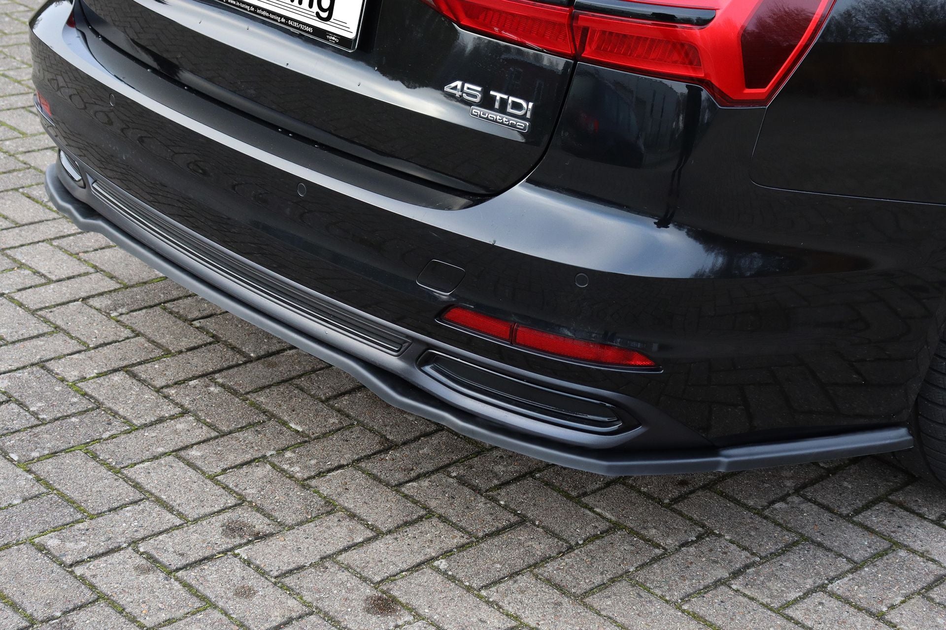 Heckspoilerlippe für Audi A6 4K C8 ab 2018-2023, Ingo Noak Tuning, zeigt die schwarze Kunststoff-Frontseite und Design.