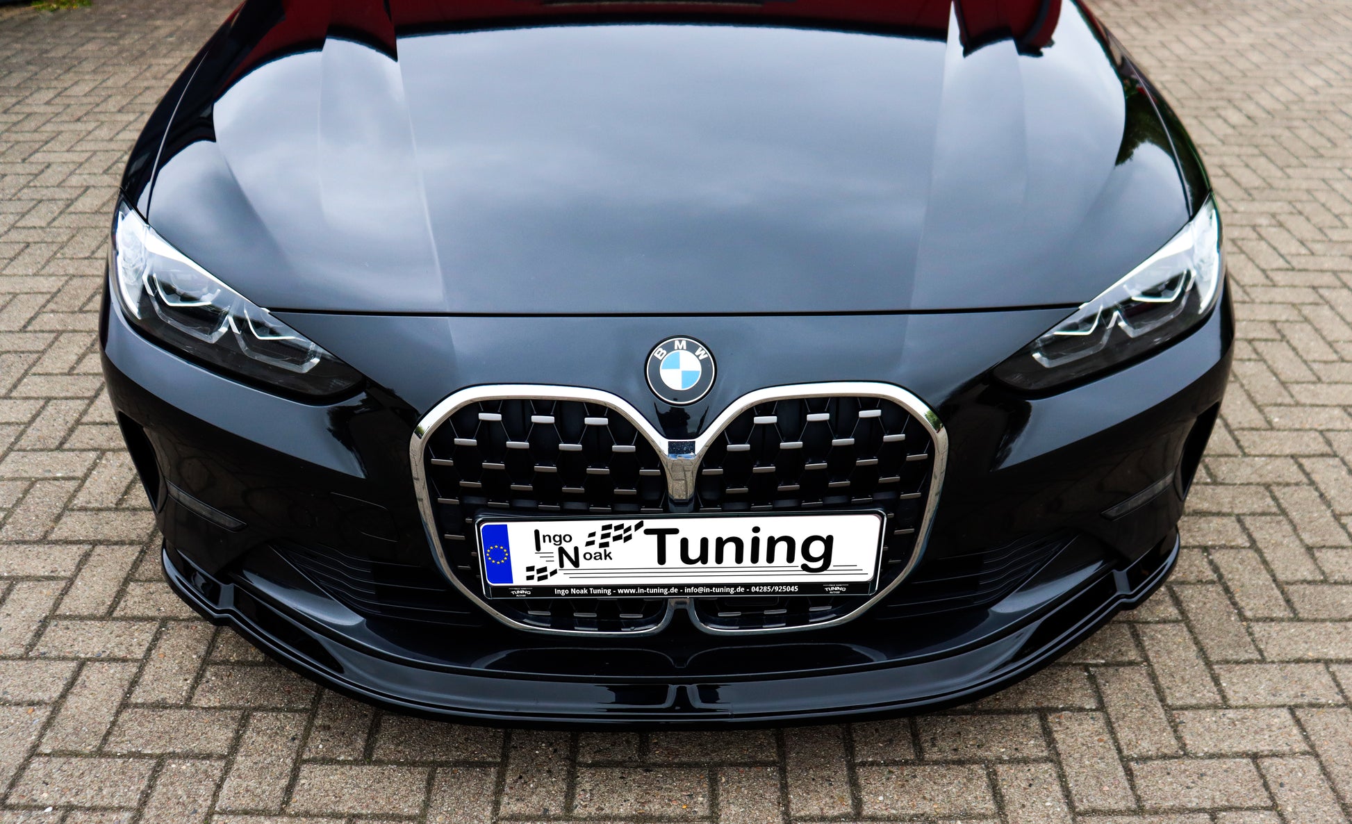 Schwarz lackierte Frontspoilerlippe für BMW 4er G22/G23 ohne M-Paket von Ingo Noak Tuning, aus ABS-Kunststoff gefertigt